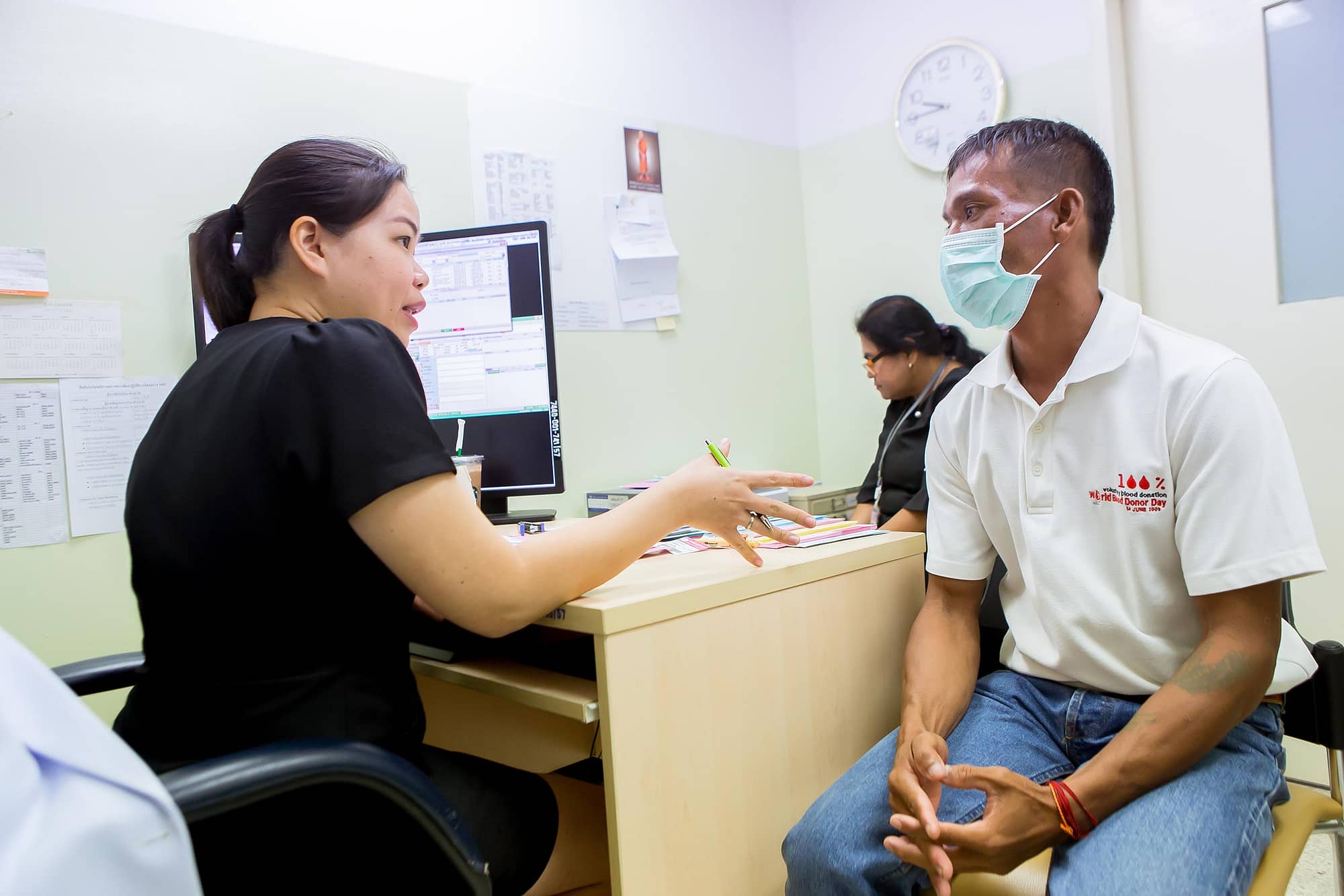 Doctor talking with patient during a consultation