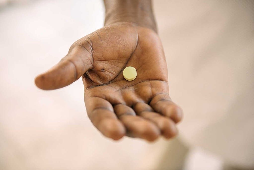 Fexinidazole pill in a hand