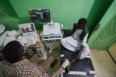 Healthcare worker examining a patient