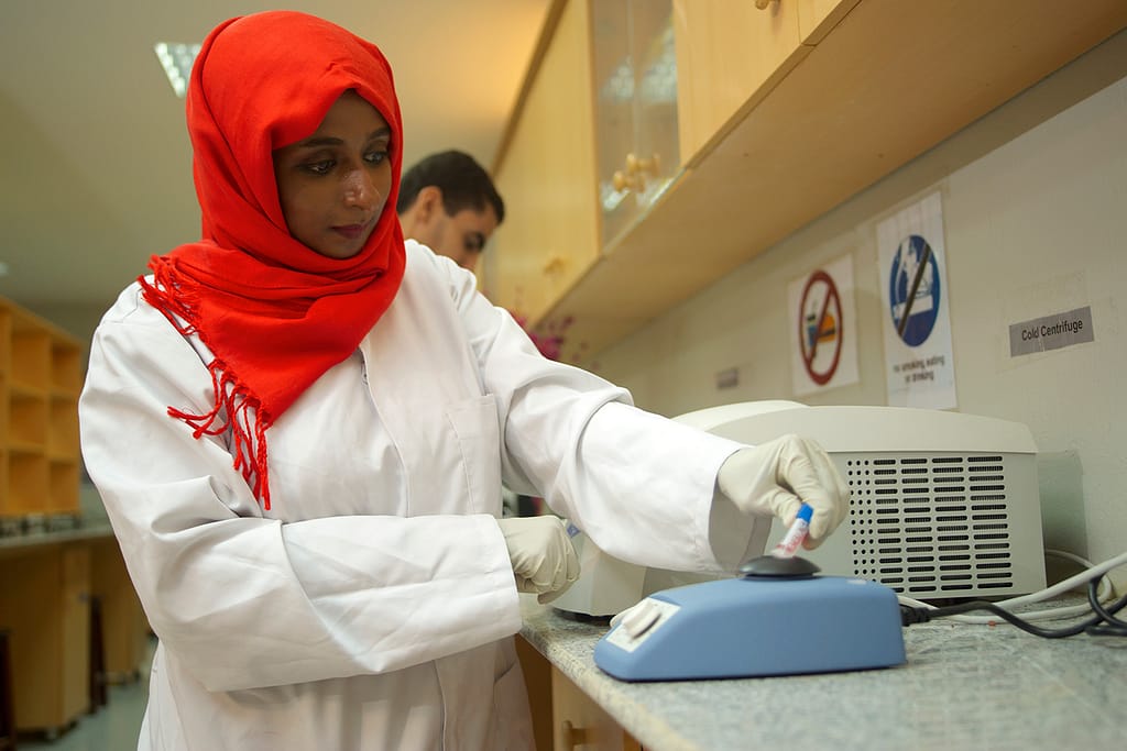 Women from the research staff testing drugs