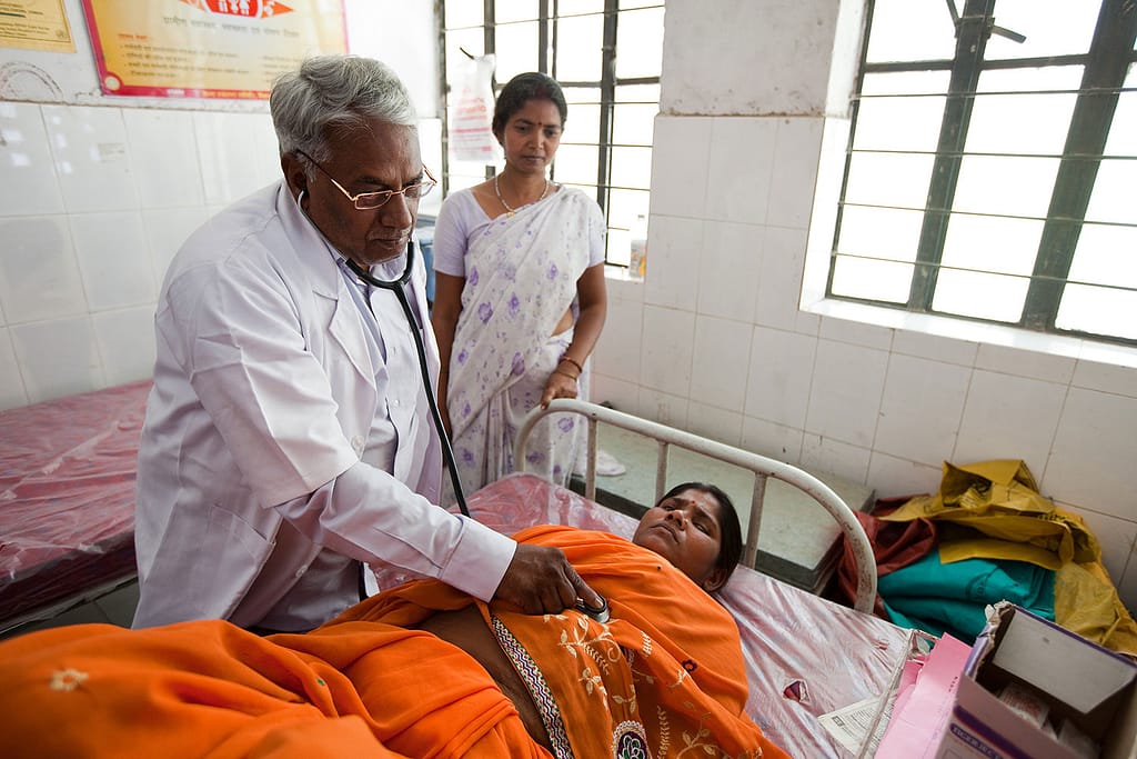 Doctor examining a woman in a hospital
