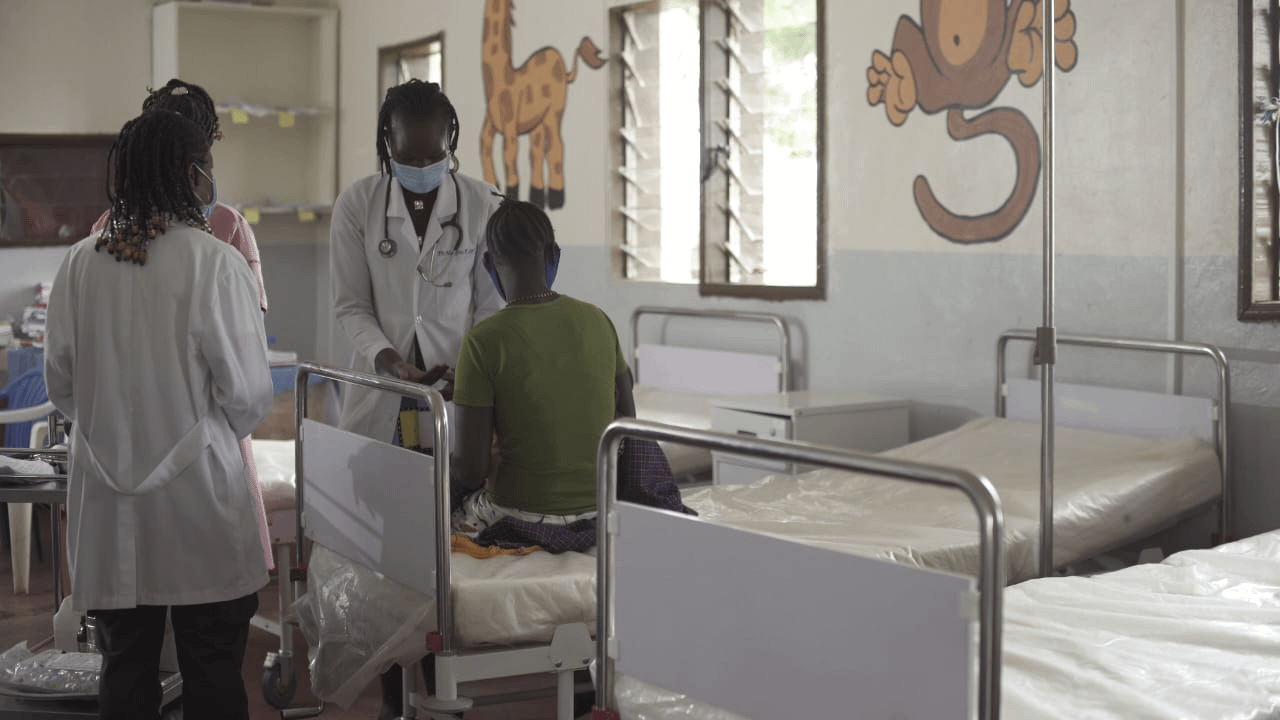 Dr Loyce Faith Nangiro visting a patient on the ward