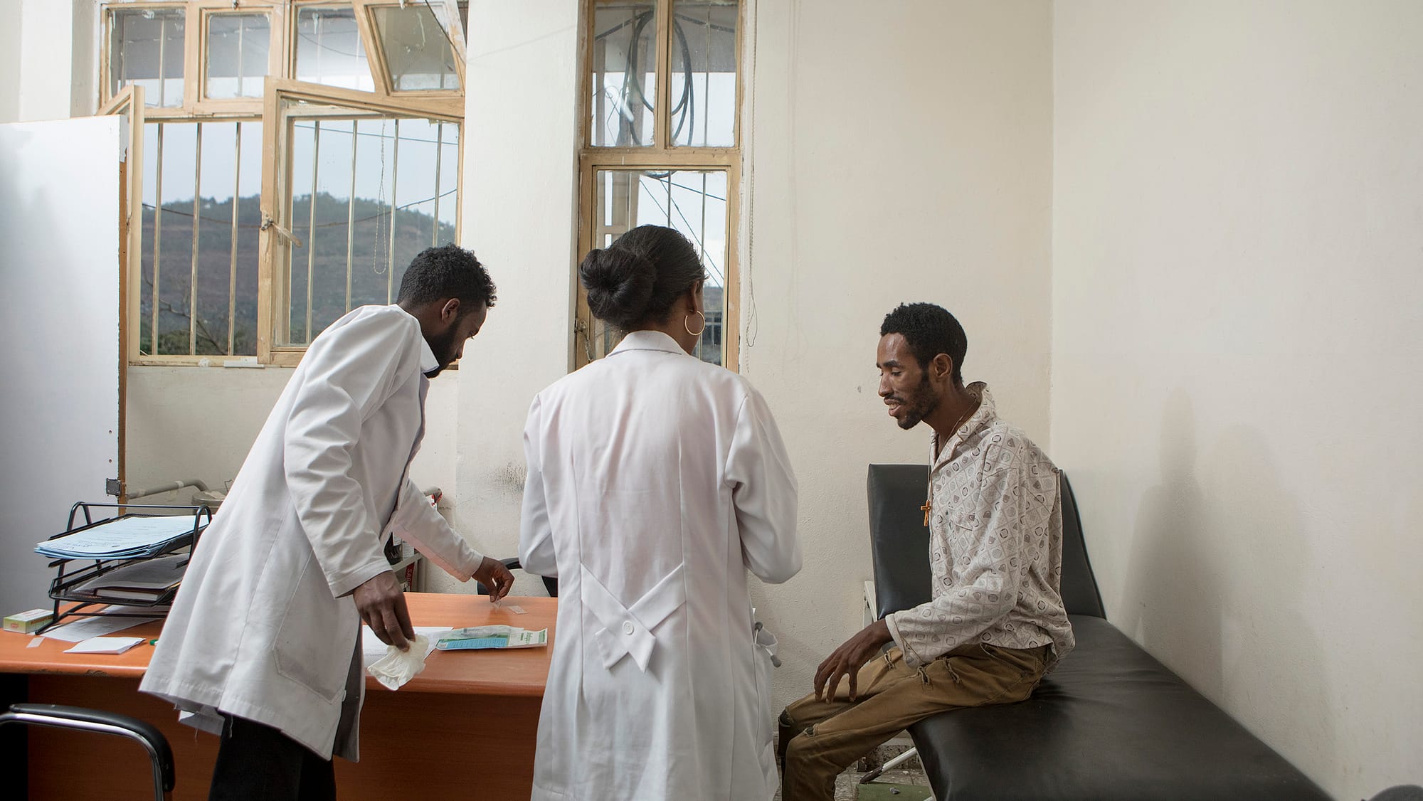 Patient speaking with two doctors
