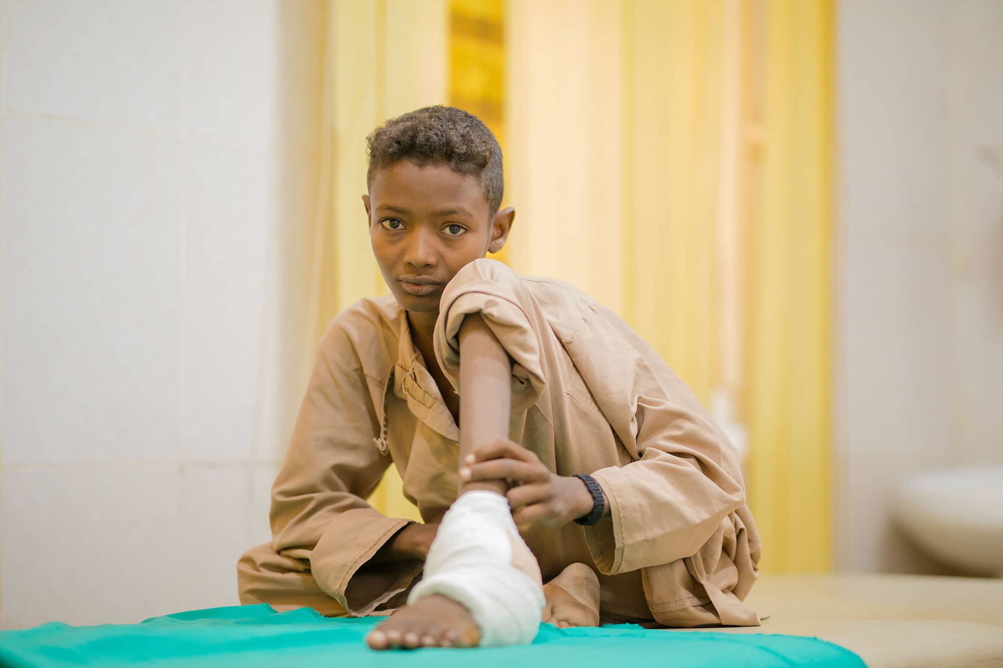 Young man with mycetoma in hospital setting
