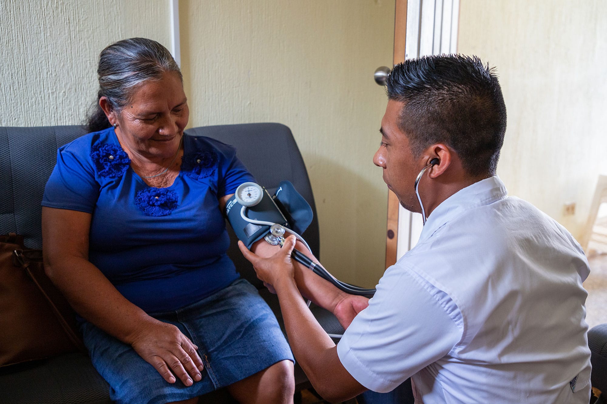 Healthcare worker with a woman in hospital setting