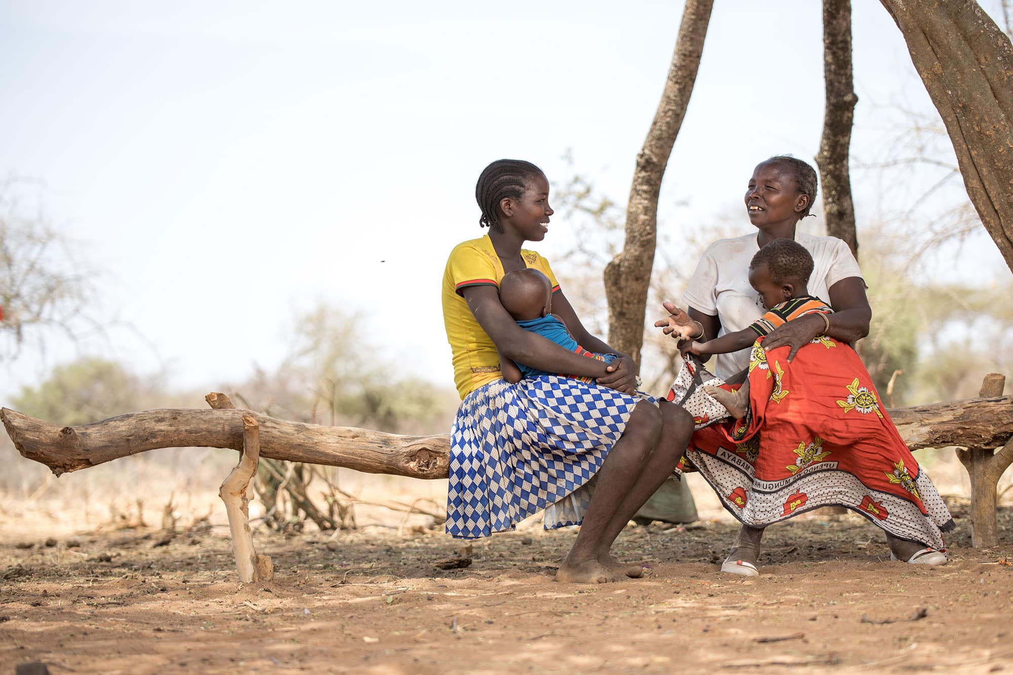 Women with their children in rural setting