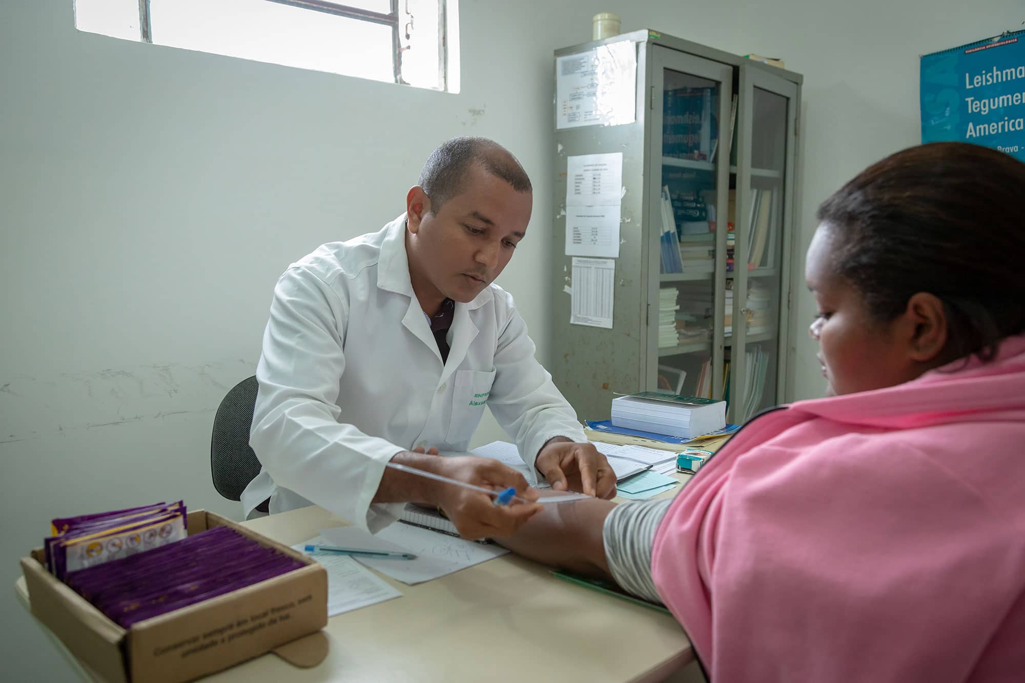 Healthcare worker with patient in hospital setting