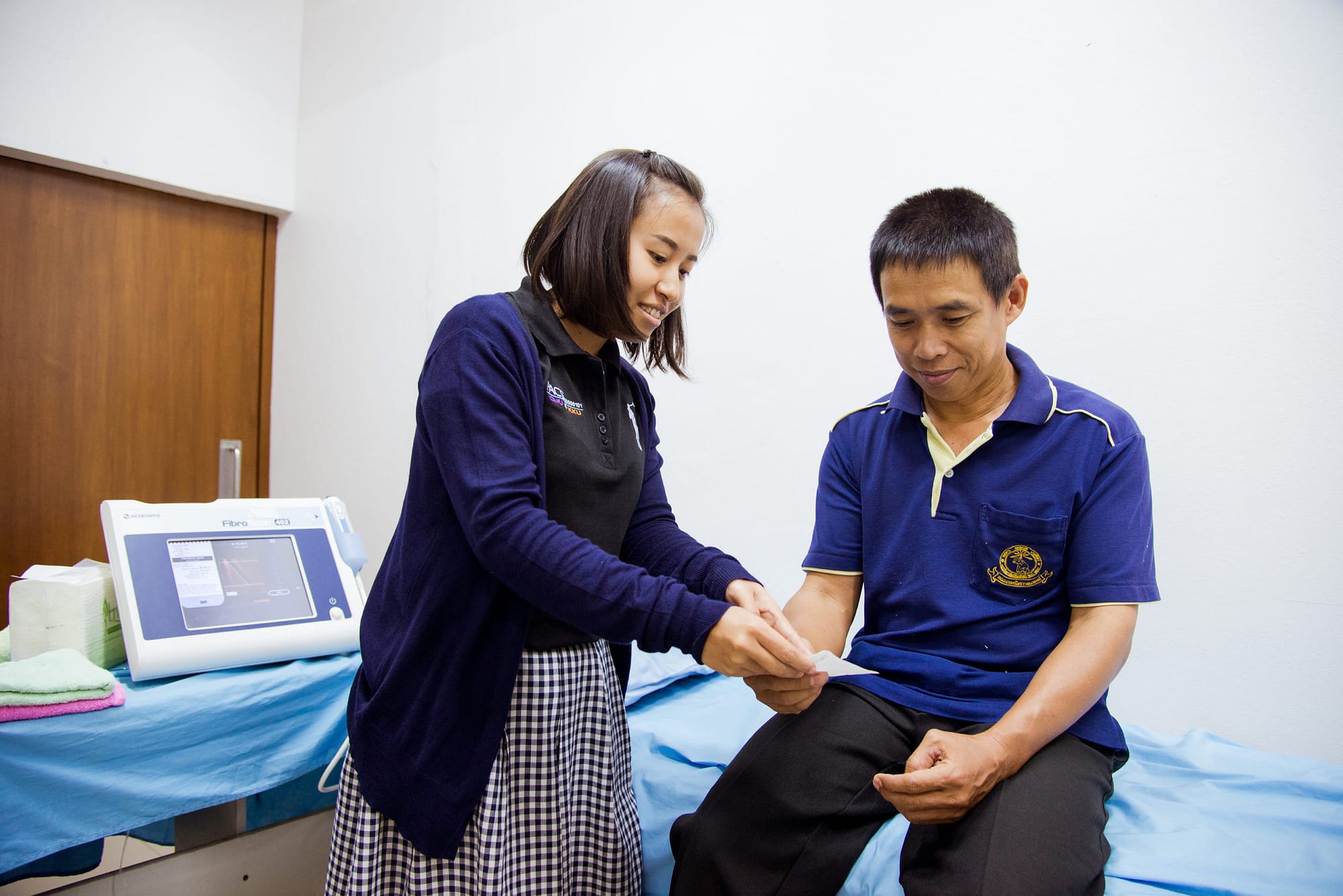 Healthcare worker with a patient in hospital setting