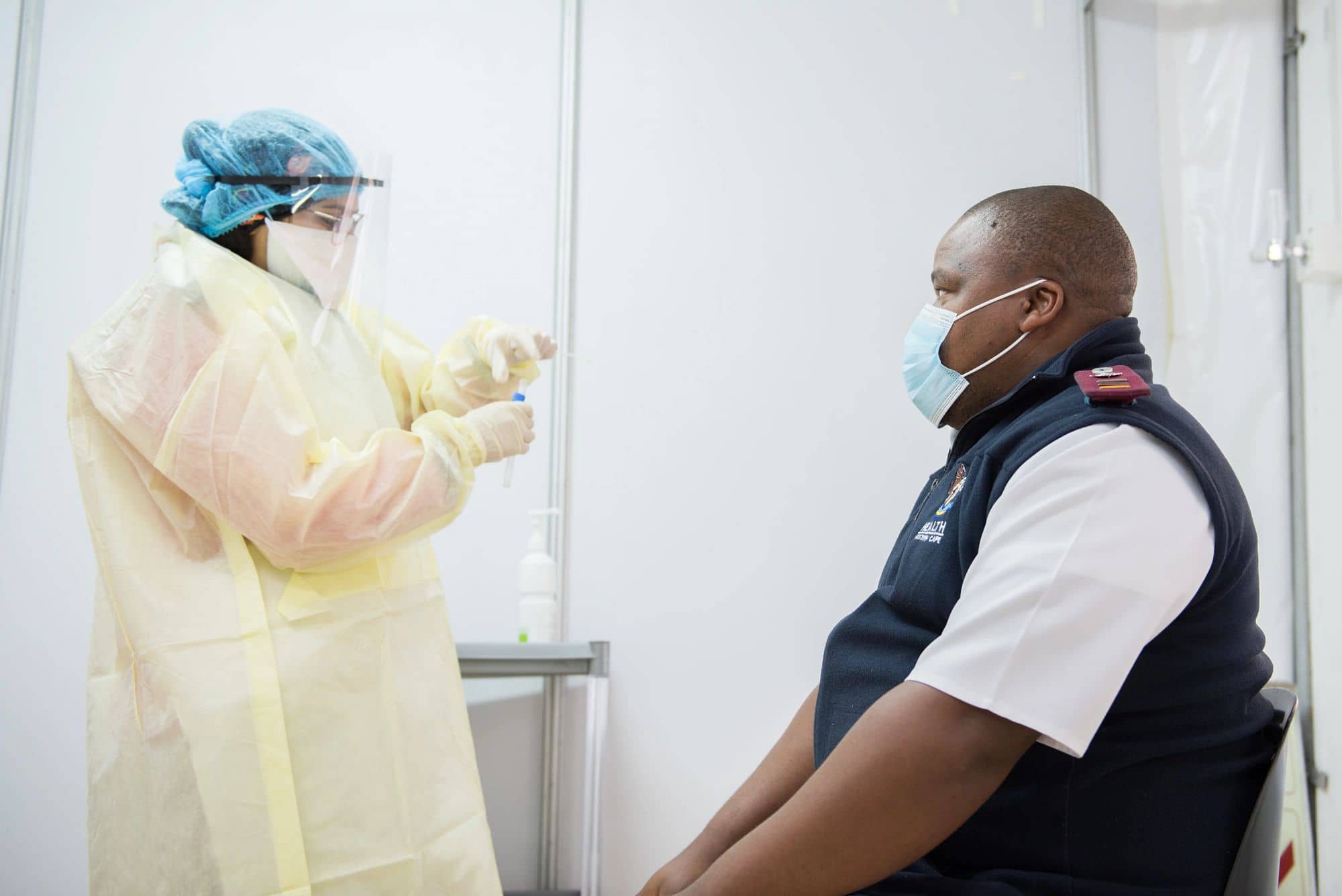 Healthcare worker conducts COVID-19 test in South Africa