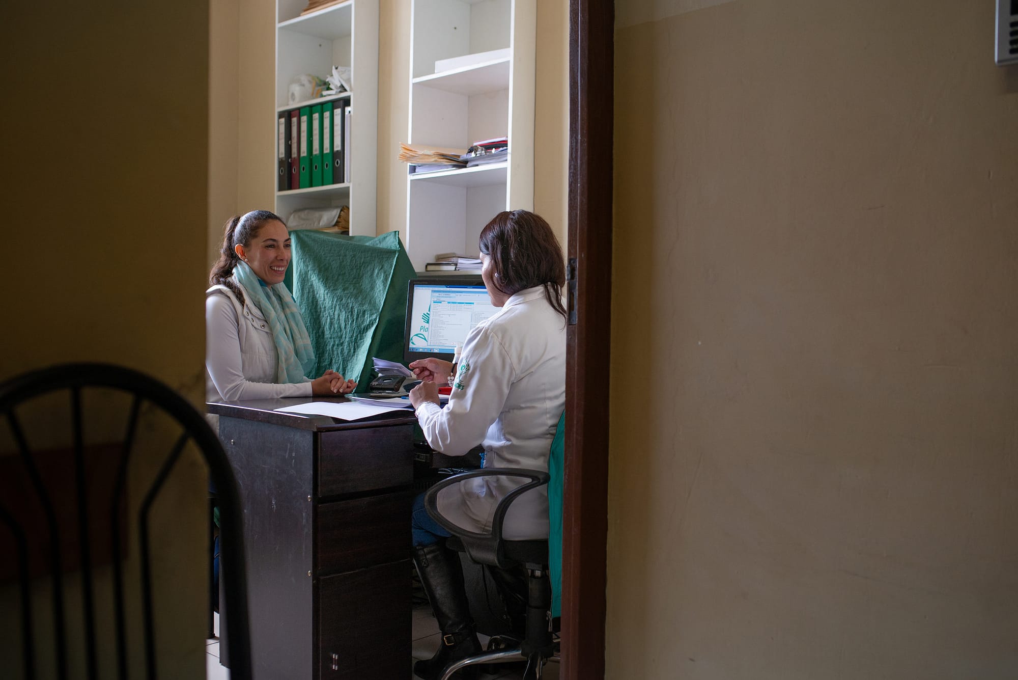 Two woman discussing in hospital setting